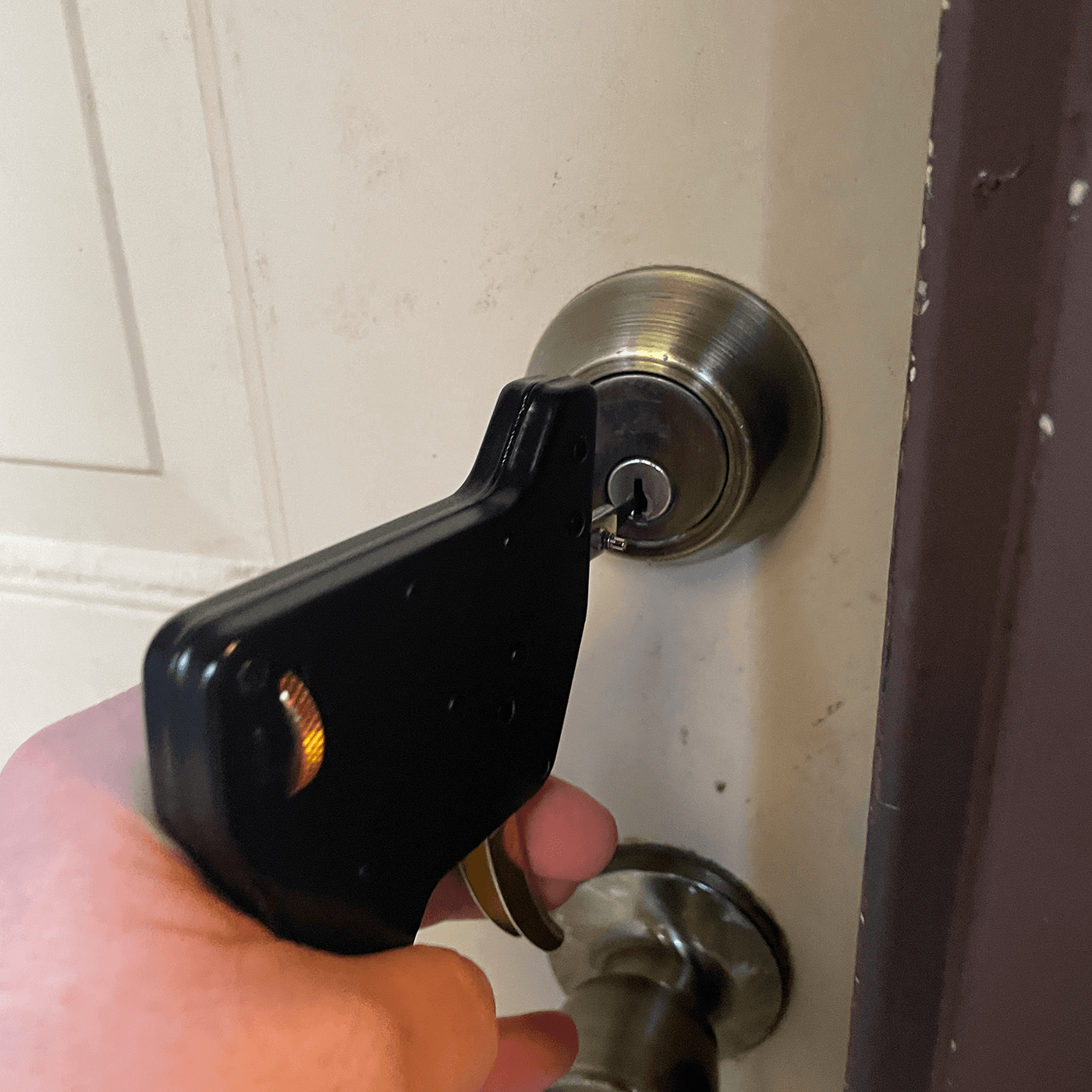 A specialist unlocking a front door